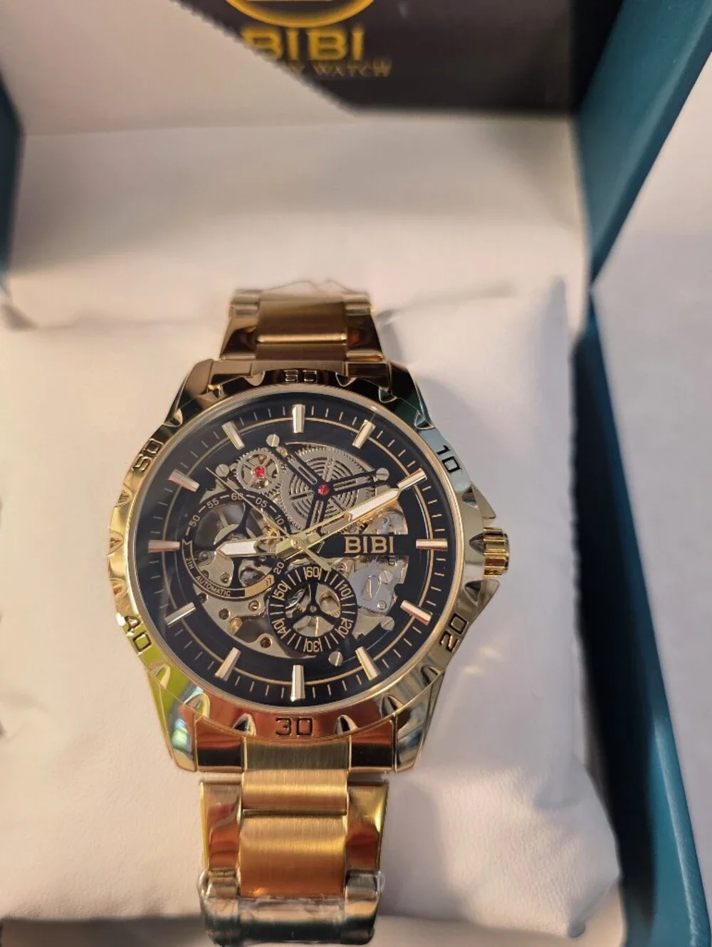 BiBi Gold Tone Skeleton Dial Watch with Black Accents
